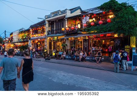 Hoi An, Vietnam - August 14, 2015: restaurants and shops on the banks of the Thu Bon river on Nguyen Phuc Chu in Hoi An at night.