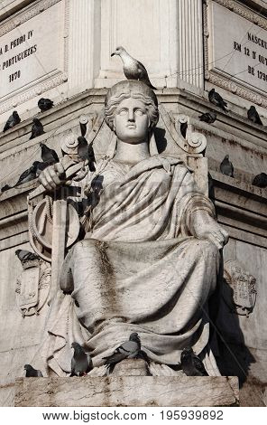 Sculture in Dom Pedro column at Rossio Square. Lisbon, Portugal