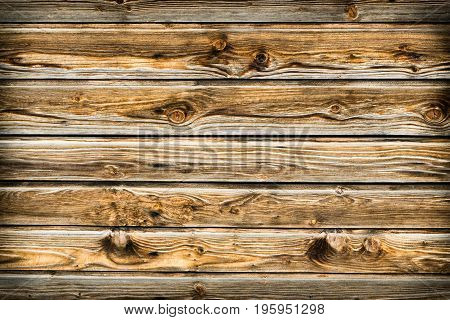 Natural brown barn wood wall. Wooden wall background design. Wood planks, boards are old with a beautiful rustic look. Timber design style.