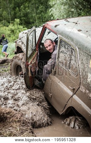 LUBOTIN UKRAINE - JULY 23 2016: RFC Ukraine Wild Boar Challenge 2016. Portrait of participant on UAZ 469.