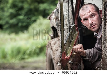 LUBOTIN UKRAINE - JULY 23 2016: RFC Ukraine Wild Boar Challenge 2016. Portrait of participant on UAZ 469.