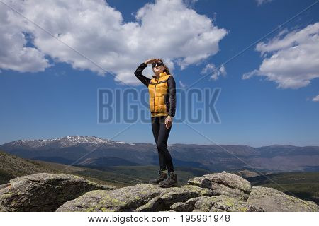 Woman Looking At Sky On Rock Peak In Guadarrama