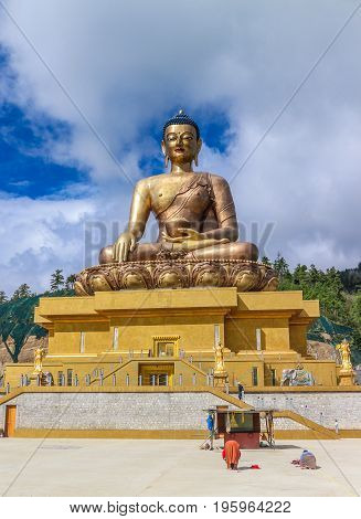 Front View Of Giant Buddha Dordenma Statue With The Blue Sky And Clouds Background, Thimphu, Bhutan