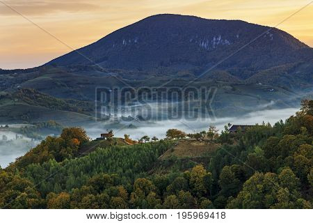 Autumn nature with misty landscape, Holbav village, Carpathians, Transylvania Romania Europe