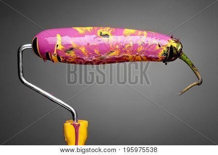 Paint Roller Eggplant With Smashing Yellow And Purple Paint On Gray Background. Fashion Food Concept