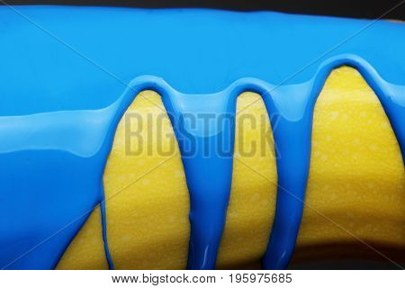 Pouring Blue Paint Over Zucchini Background, Macro Closeup.texture.abstract