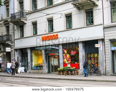 Zurich, Switzerland - August 9, 2007: Downtown City With Migros Grocery Store Shop Sign Exterior
