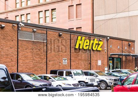 Montreal, Canada - May 26, 2017: Hertz Car Rental Sign And Brick Building In Downtown Area Of City I