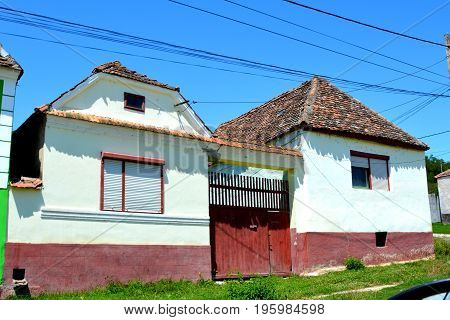 Typiceal peasant house in the village Ungra, a commune in Braşov County, Romania. In Ungra there is a medieval 13th century Transylvanian Saxon church and many old houses.