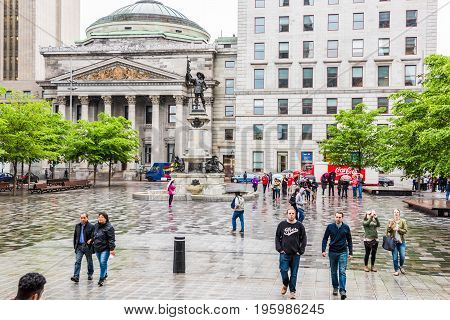 Montreal, Canada - July 26, 2014: Old Town Area With Centaur Theater And Statue Outside Notre Dame B