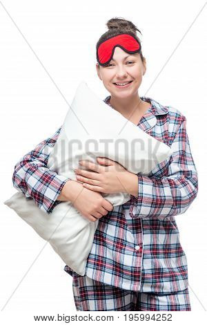 Woman In Clothes For Sleep With A Pillow In Hands On A White Background