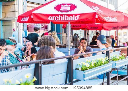 Montreal, Canada - May 27, 2017: People Sitting In Restaurant At Table In Outside Seating Area In Ga