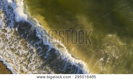 White Caps Roll In On Top Of Ocean Surf At Sandbridge Beach