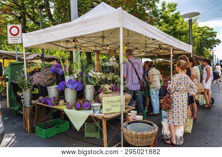 Zurich, Switzerland, 07/29/2016. Tent With Garden Flowers On The Street In The City. People Buy Seed