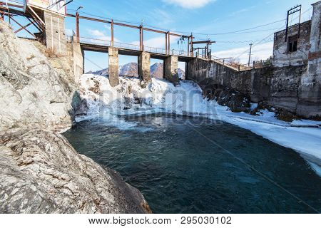 Old Hydro power station in Chemal, Altai,Siberia, Russia. Winter sunny day. A popular tourist place