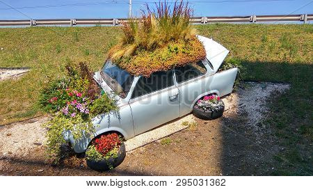 Budapest, Hungary - Aug 8, 2018: Beautiful Funny Vintage Trabant Car Parking Behind An Unknown Parki