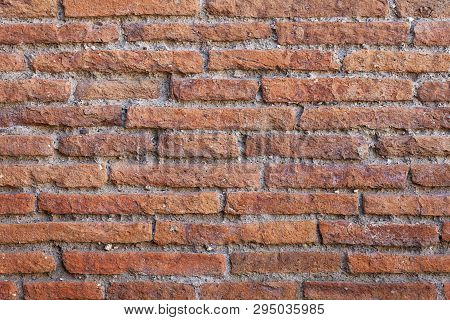 Old Red Brick Wall Texture Background With Scratches, Cracks, Dust, Crevices, Roughness. 
Grungy Wid