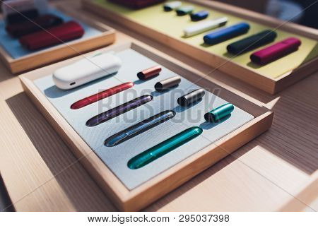 New Design Iqos. Showcase With A Large Multi-colored Selection System Of Heating Of Tobacco. Color D