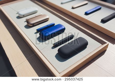New Design Iqos. Showcase With A Large Multi-colored Selection System Of Heating Of Tobacco. Color D
