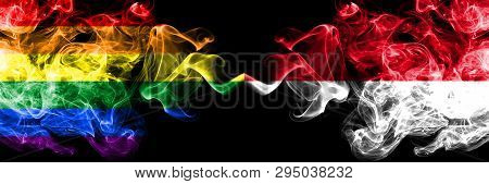 Gay Vs Monaco, Monacan Smoke Flags Placed Side By Side. Thick Colored Silky Smoke Flags Of Pride And
