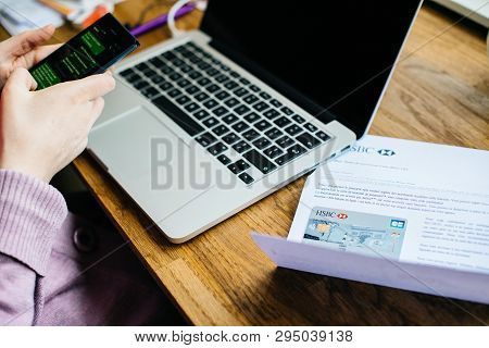 Paris, France - Apr 9, 2017: Woman Activating On The Smartphone Her New Hsbc French Division Featuri