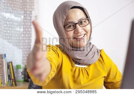Portrait Of Muslim Businesswoman Offers Hand Shake, Deal Partnership Agreeement Concept, Selective F