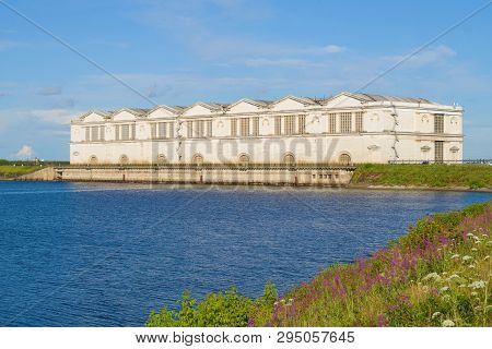The Old Building Of The Rybinsk Hydroelectric Station On A Sunny July Day. Yaroslavl Region, Russia