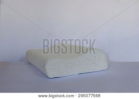 Modern Pillow On A Foam Base On A Light Background Close-up.