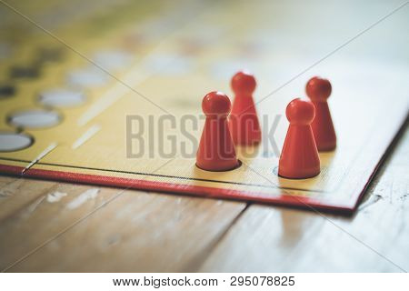 Playing A Parlor Game: Meeples On A Table, Ludo
