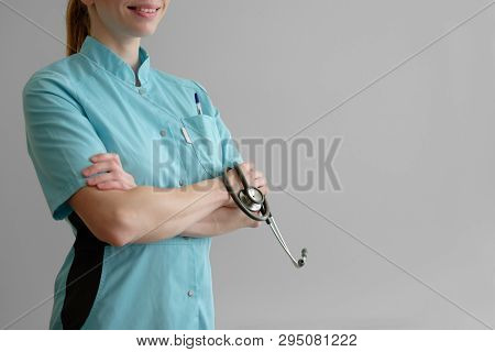 Woman Laborant Working With Microscope Holding Automatic Pipette