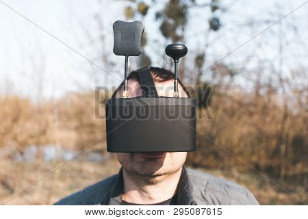 Fpv Drone Pilot In A Virtual Reality Helmet With A Remote Control From A Copter Flies In Aircraft Ou