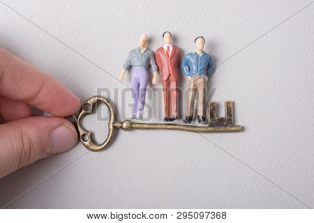 Tiny Figurine Of Man Miniature And Retro Key
