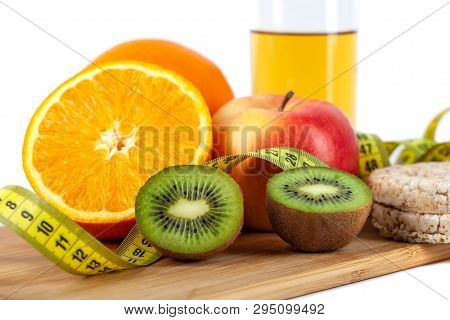 Apple, Orange, Kiwi With Measure Tape On White Background