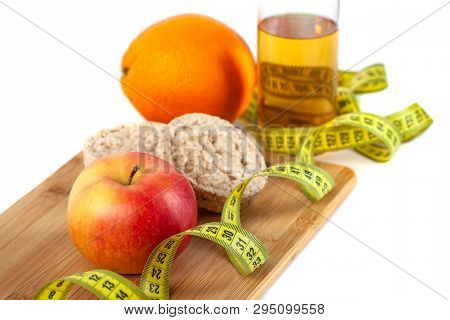 Apple, Orange, Kiwi With Measure Tape On White Background