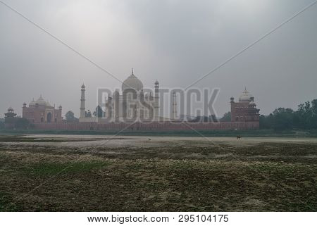 Taj Mahal And Yamuna River View In Morning Fog From Mehtab Bagh Or The Moonlight Garden, Agra, India