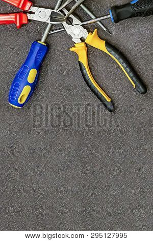Set Of Hand Tools Screwdriver With Blue Rubber Handle Pliers Home Repair Copy Space