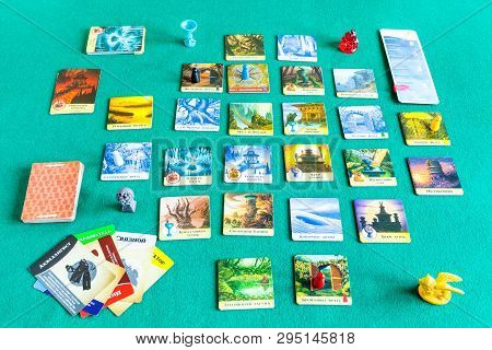 Moscow, Russia - April 3, 2019: Playing In Forbidden Island Cooperative Board Game (russian Edition)