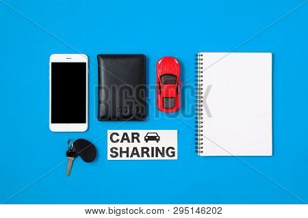 Car Sharing Concept. Composition With Driver's License, Blank Paper, Toy Car, Car Key And Text Sign 