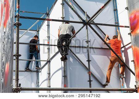 Kyiv, Ukraine - May 05, 2017: Worker Prepares Billboard To Installing New Advertisement On The Indep