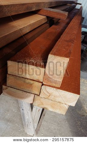 Wood background. Wood texture. Pine ends. Background ends of the boards. The ends of the lumber.