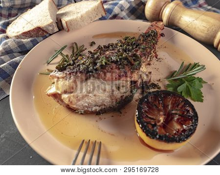 Roasted Sea Bass With Beurre Noir Sauce And Caramelized Lemon