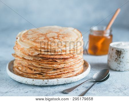 Stack Of Traditional Russian Pancakes Blini On Gray Background With Copy Space. Homemade Russian Thi
