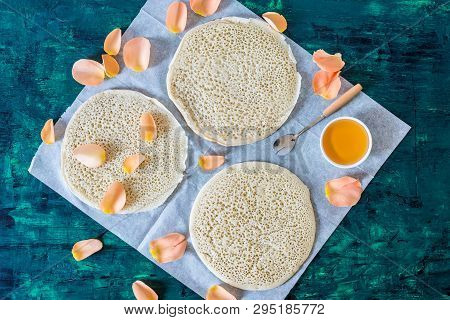 Traditional Moroccan Pancakes Baghrir On Dark Green Wooden Background , Top View , Flat Lay