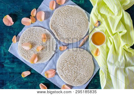 Traditional Moroccan Pancakes Baghrir On Dark Green Wooden Background , Top View , Flat Lay