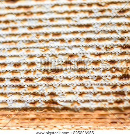 Texture Of Jewish Passover Matzah Unleavened Bread. Symbols Of Passover- Jewish Matza.