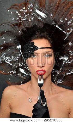 Top View On A Young Beautiful Brunette. Lying In The Placer Gems, Cutlery Forks, Glasses For Wine. I