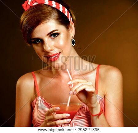 Pin up girl drink red long cocktails on redux style themed night party.