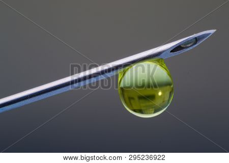 Hypodermic Needle With One Drop Of Drug On His Peak