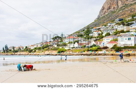 Kids Playing On Fish Hoek Beach On A Cloudy Day