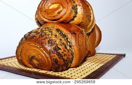 Roll With Poppy Seed Filling On A Napkin, White Background